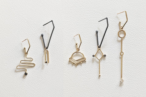 Charms styled with Hoop Earrings