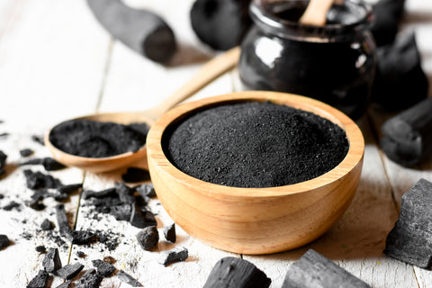 Activated charcoal for soap making in a bowl - Soap.Club