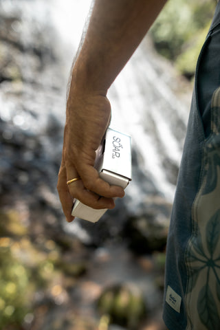 Man holding Soap.Club natural soap in box - Soap.Club