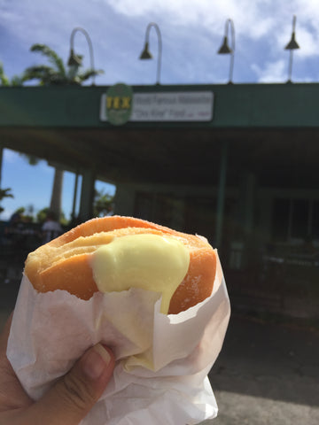 bavarian cream malasada in front of tex drive in honokaa