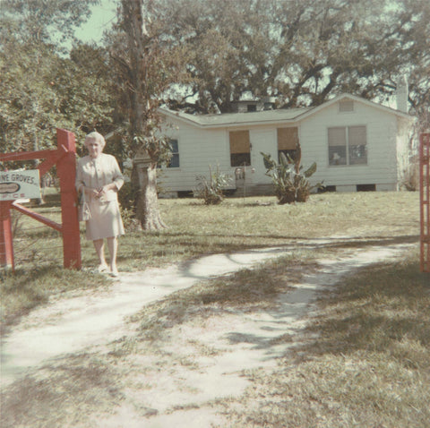 Granny in front of first Range Line office