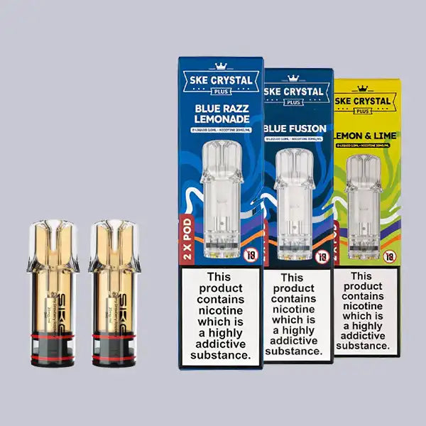 SKE Crystal Plus Pods Three SKE Crystal Plus prefilled pod boxes in a row on the right, with two pods on the left, on a grey background.