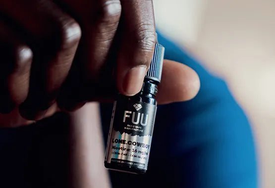 A 10ml bottle of The Fuu Original Silver Lone Cowboy being held up to the camera.