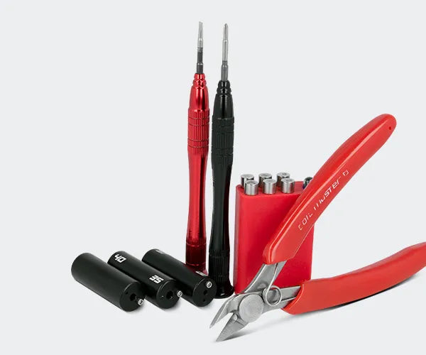 A pair of wire cutters and screw drivers, alongside other vaping tools on a grey background.