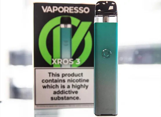 A Vaporesso XROS 3 vape device stood in front of its box on a white background.