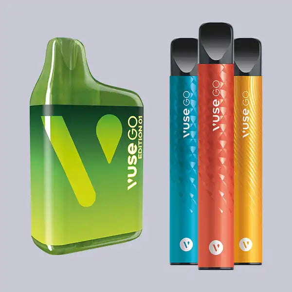 Four Vuse GO disposable vapes in a row on a grey background.