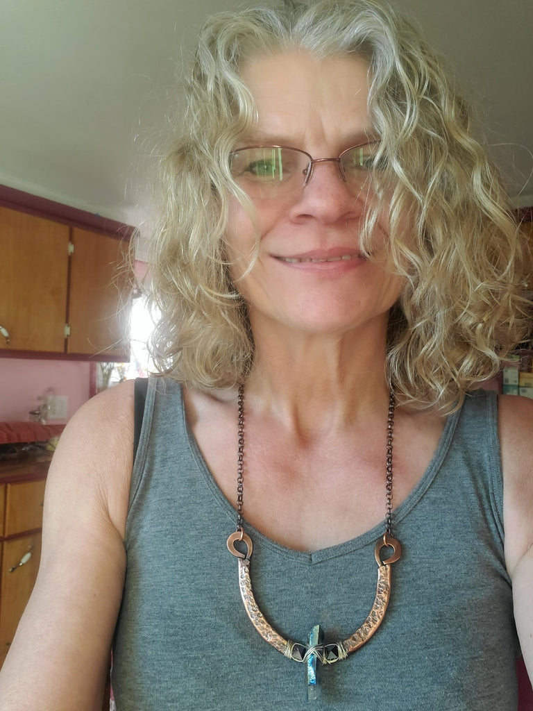 Alexa Martha from Alexa Martha Designs is wearing the Fight For The Truth Warrior Necklace