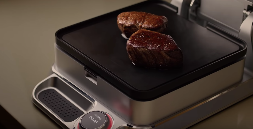 Two luscious steaks browning on the Cinder Grill