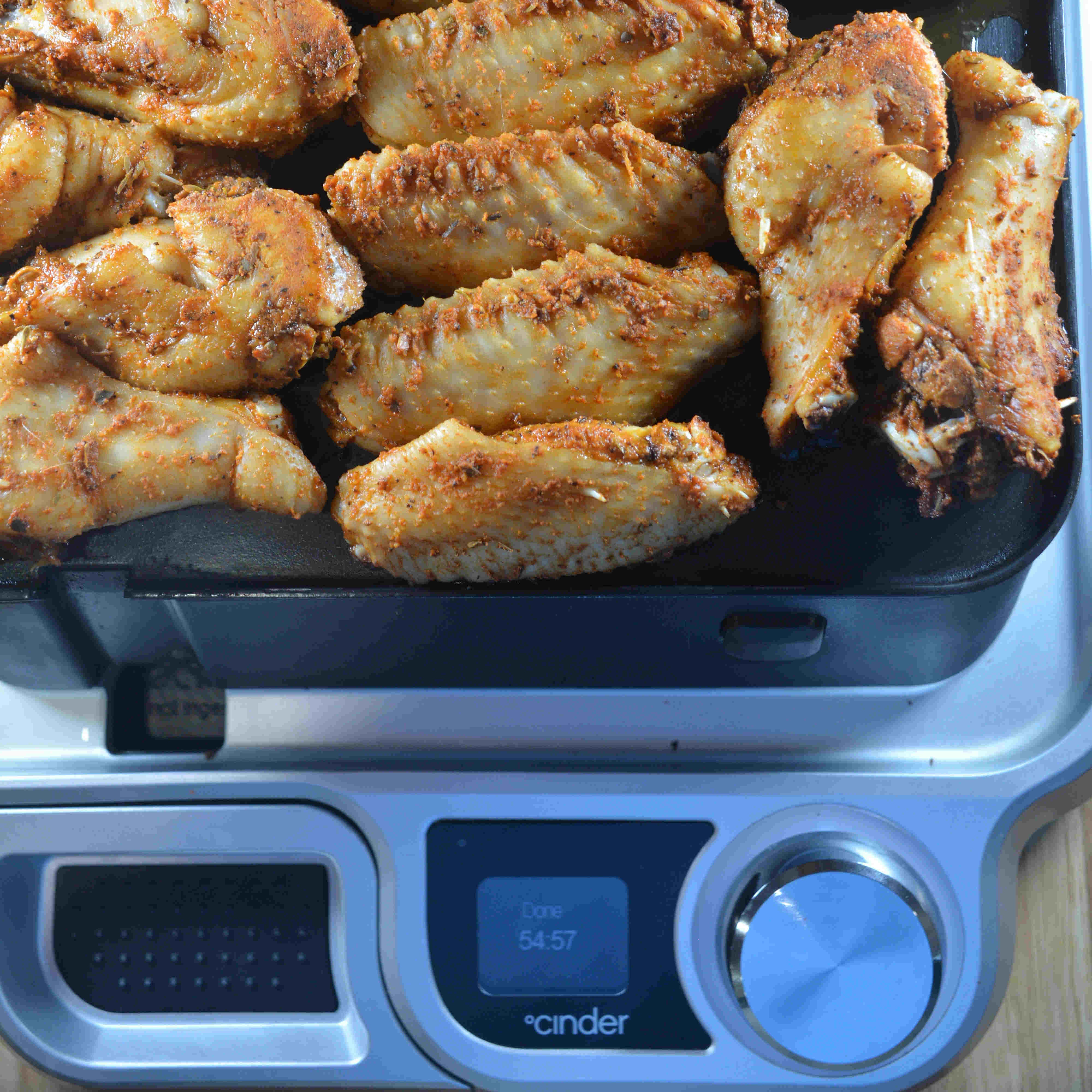 chicken wings cooked to perfection on cinder grill