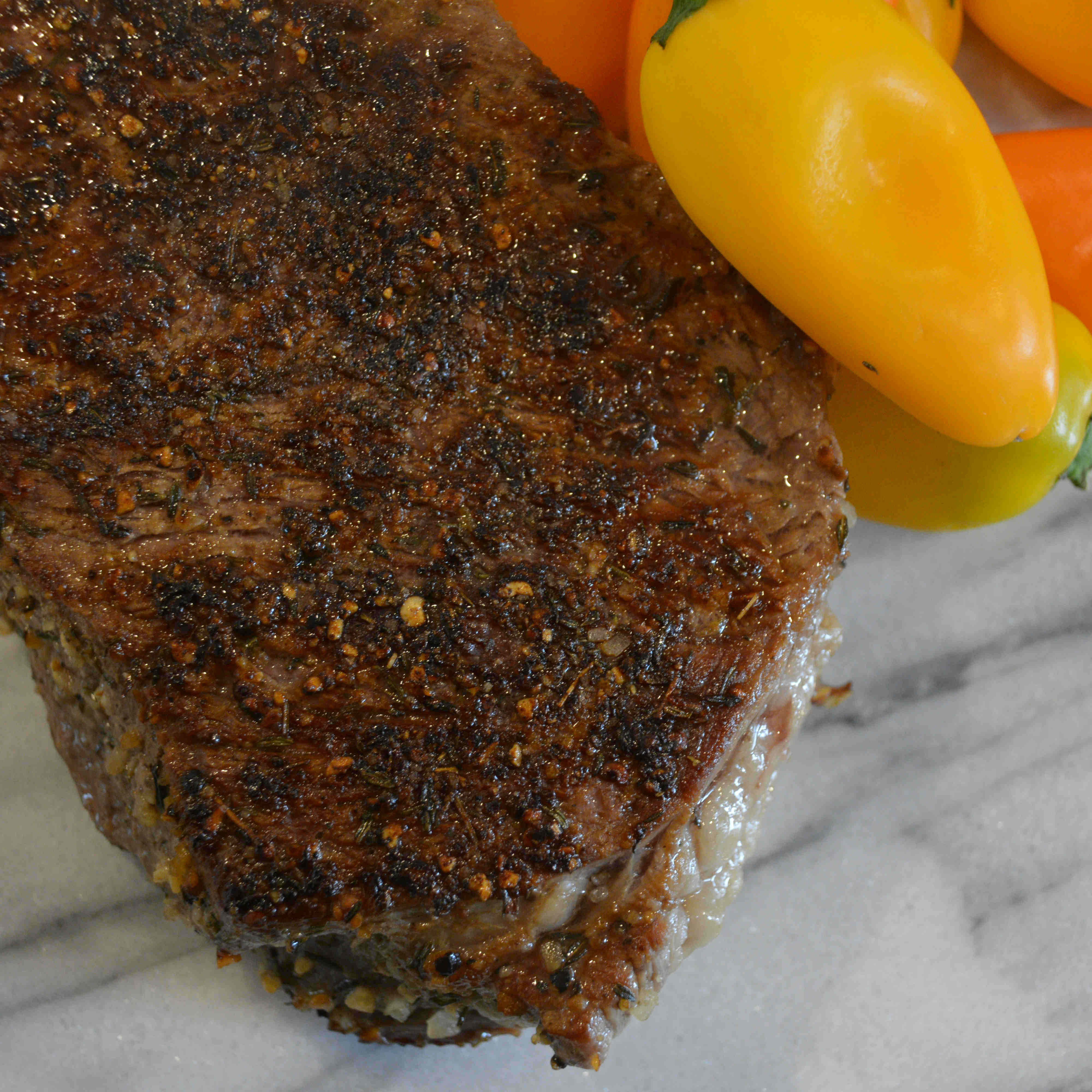 Grass-fed beef shoulder steak cooked to medium rare on a cinder precision grill 