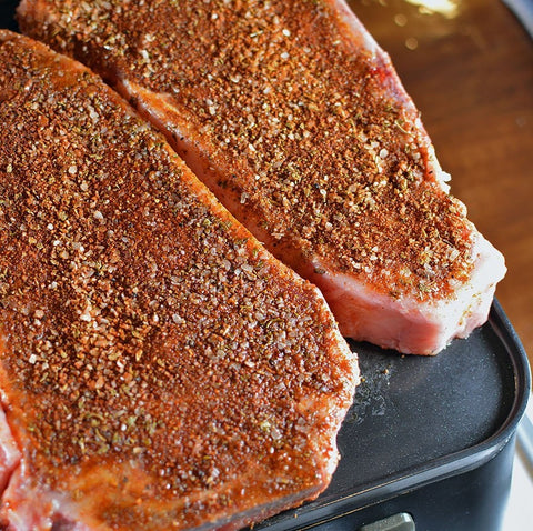 Strip Steaks rubbed with SouthWest Seasoning coming to temperature on the Cinder Grill
