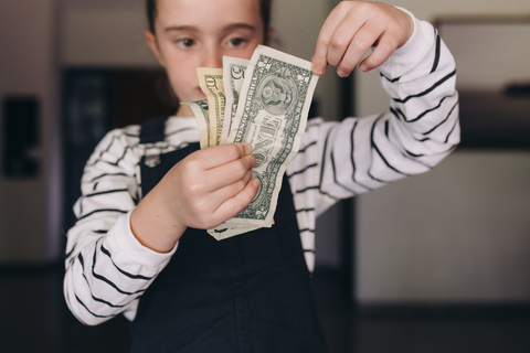 Child learning the value of money