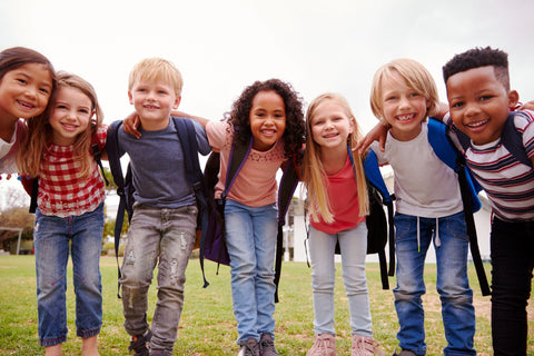 Elementary school pupils on playing field at break time