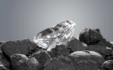Diamond sitting on coal