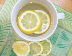Warm water with lemon in preparation for cold-pressed Living Juice cleanse