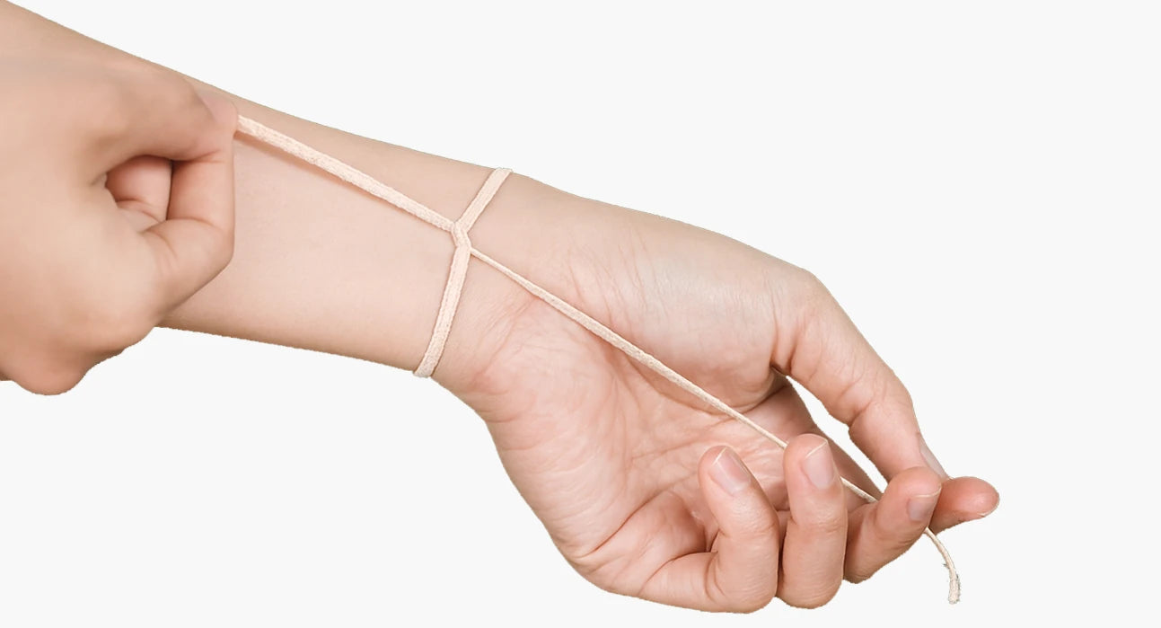 String wrapped around wrist