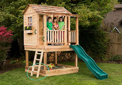 outdoor playhouse with sandbox