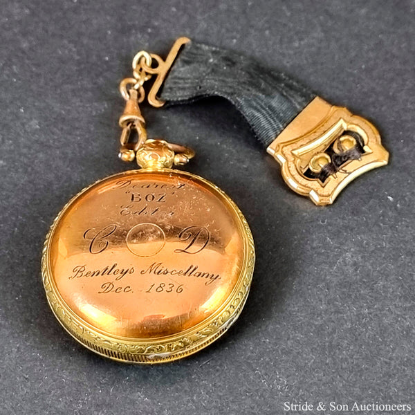 Charles Dickens's pocket watch engraved on its reverse side with the words Dearest 'Boz' Editor Bentleys Miscellany Dec. 1836 alongside initials CD