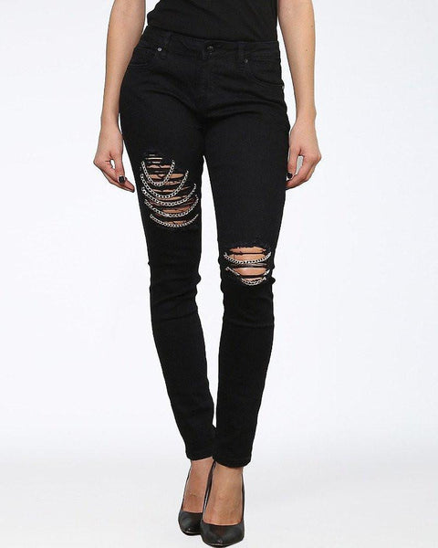 jeans with rips and chains