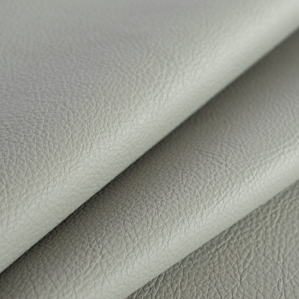 a gray vinyl performance upholstery fabric : close up view