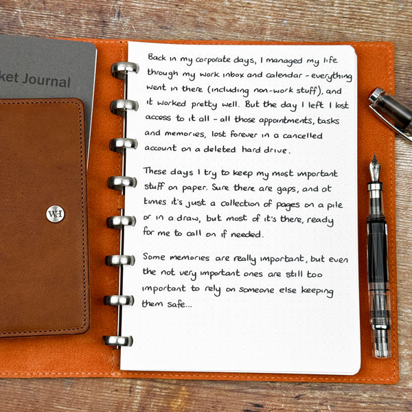 A handwritten page inside an open notebook