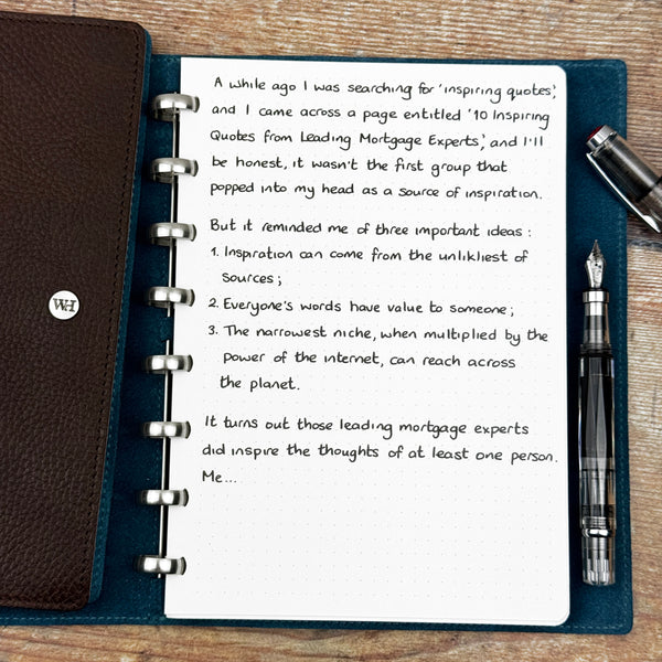 A handwritten page inside an open notebook