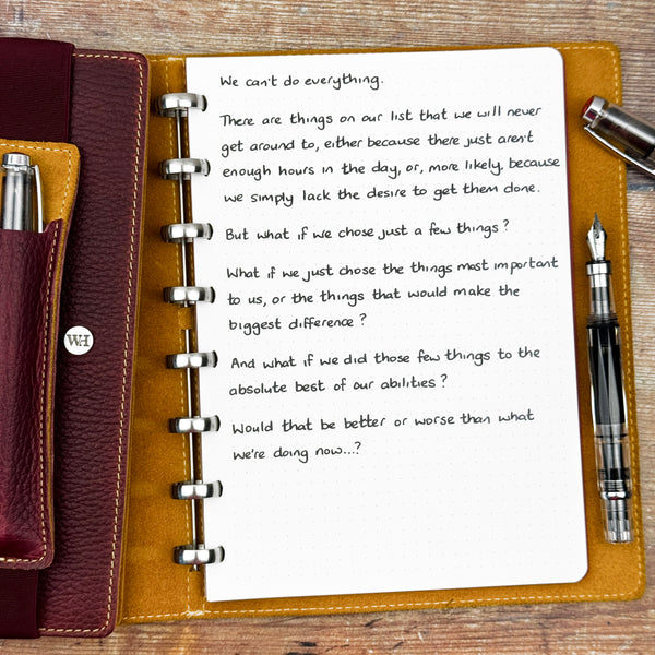 A handwritten page inside an open notebook