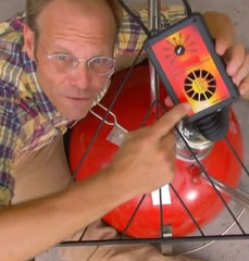 Alton Brown and his IQ110 on his famous Weber Kettle, Fireball