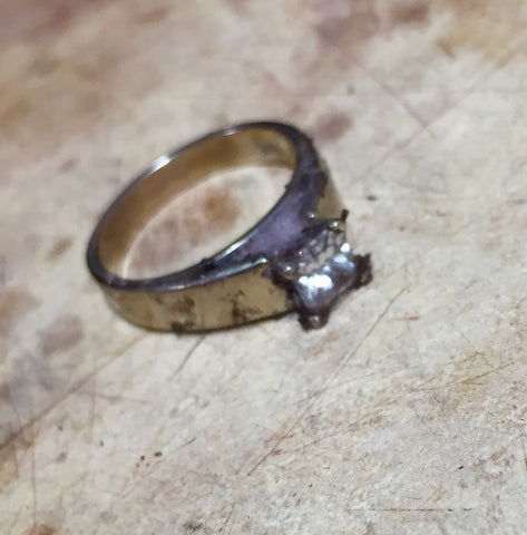 Dirty diamond engagement ring before cleaning and polishing