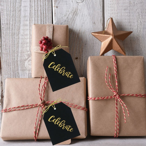 Celebrate gift tags on butcher paper gift wrapping