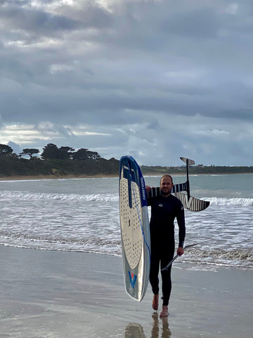 Owner of Stonker in Torquay, Ben Hucker, learning how to foil.