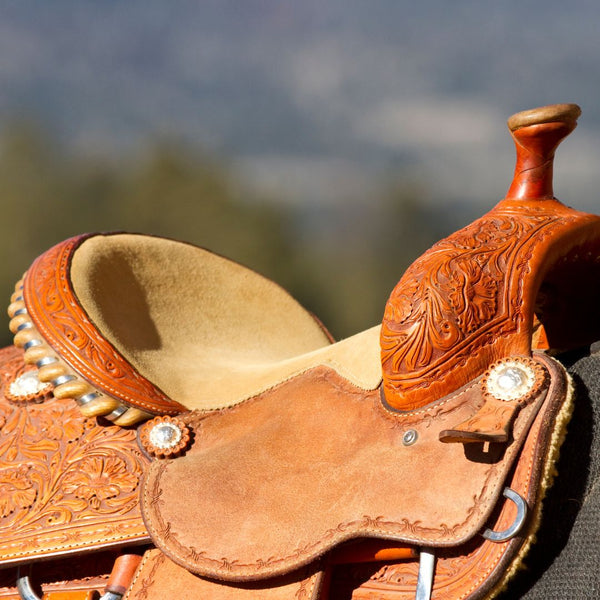 light brown western horse saddle on horses back