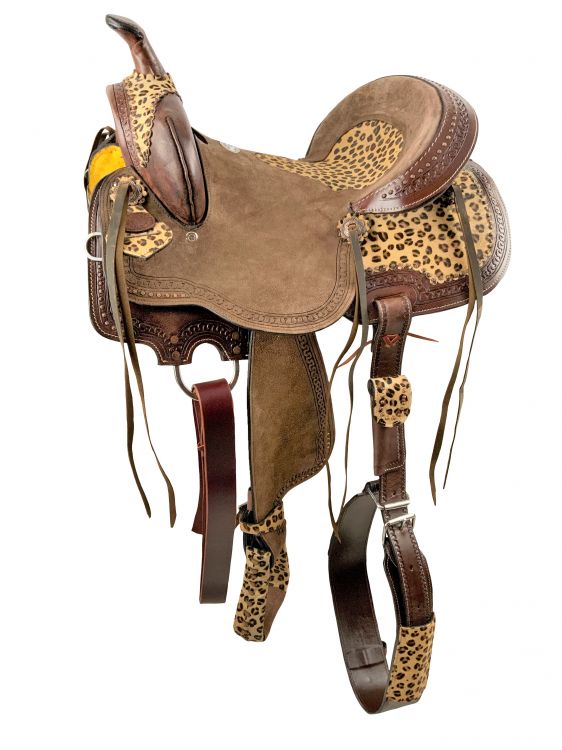 16 Semi acorn tooled Buffalo roper style saddle with rawhide silver laced  cantle.
