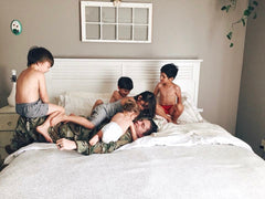 Dad wrestling with 5 children