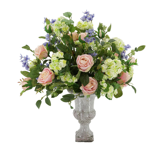 silk flowers nicely arranged on a small hay baleThis would make great  decorations for an outd…