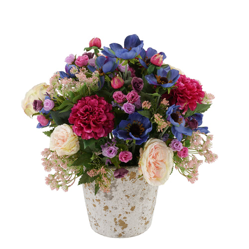 silk flowers nicely arranged on a small hay baleThis would make great  decorations for an outd…