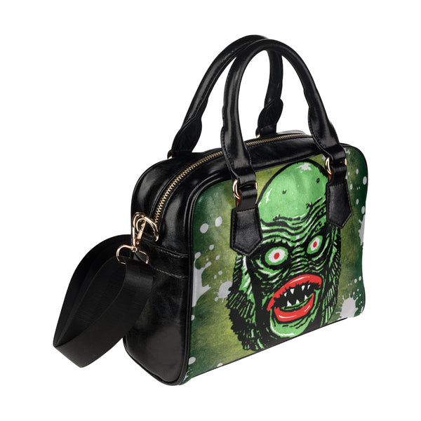 Creature on black lagoon Shoulder Handbag