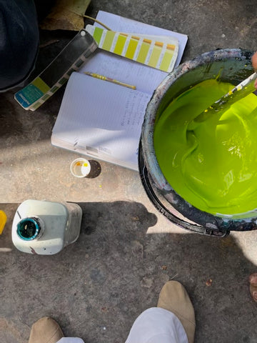 Lime green pigment/dye being made and matched by artisans to Pantone