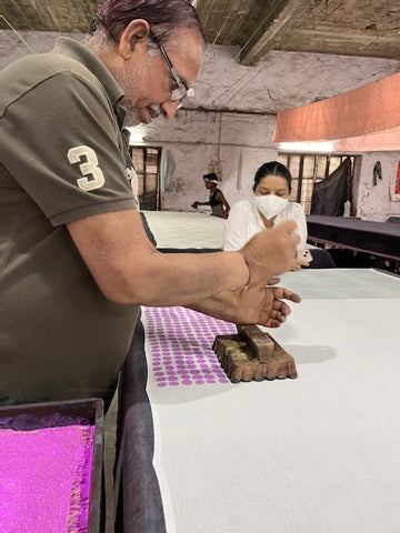 Indian artisan hand block-printing on textile