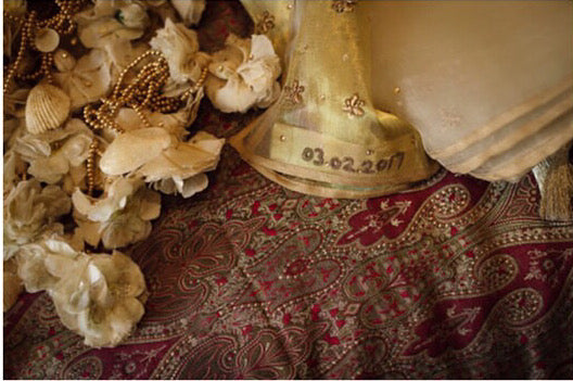 Handmade tassels on a lehenga skirt with flowers, shells and beads