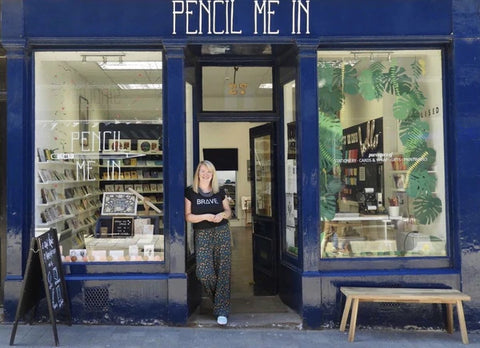 Blue shop front reading 'Pencil Me In'.