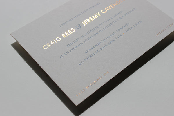 Contermporary wedding invitation with sans serif text and copper foil