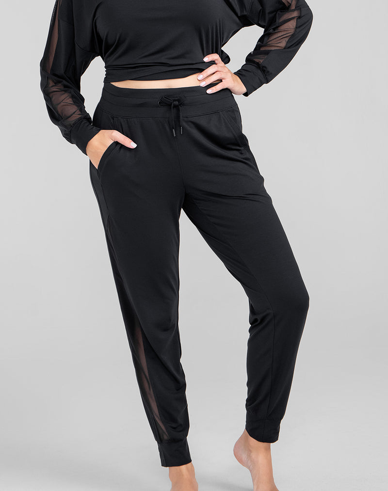 Model Raine wearing BlissWear Jogger in size Medium and color Midnight, seen from the Front