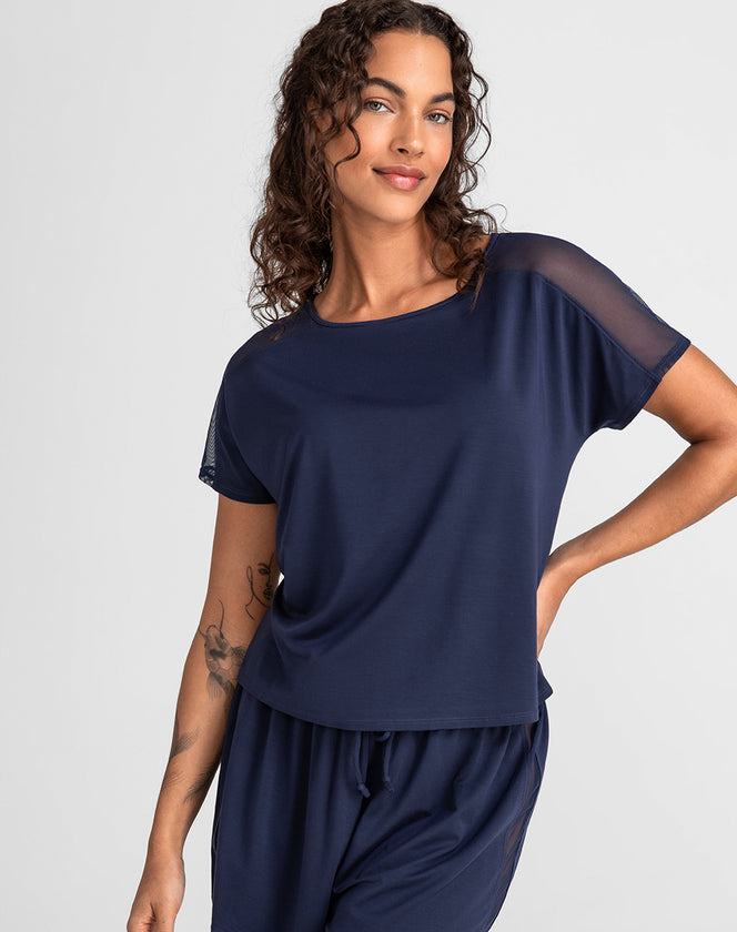 Model Jessica wearing blisswear-short-sleeve-top in size Small and color Navy, seen from the Front