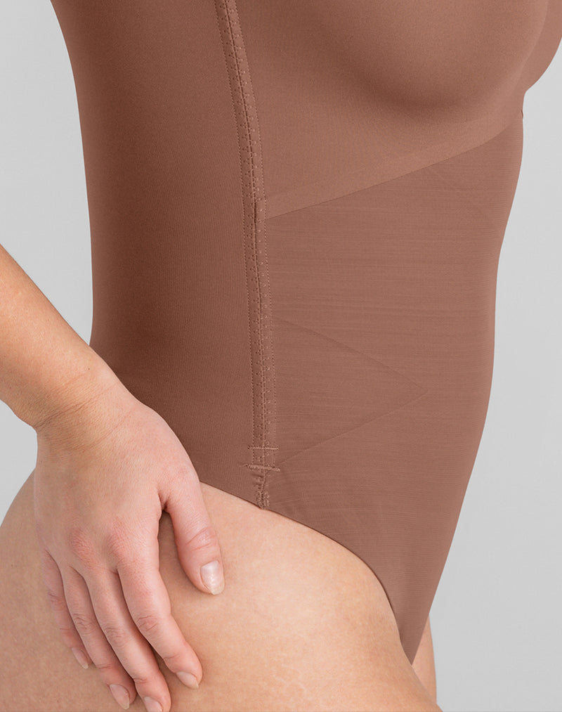 Detail of model wearing Cami Thong Bodysuit in color Toffee