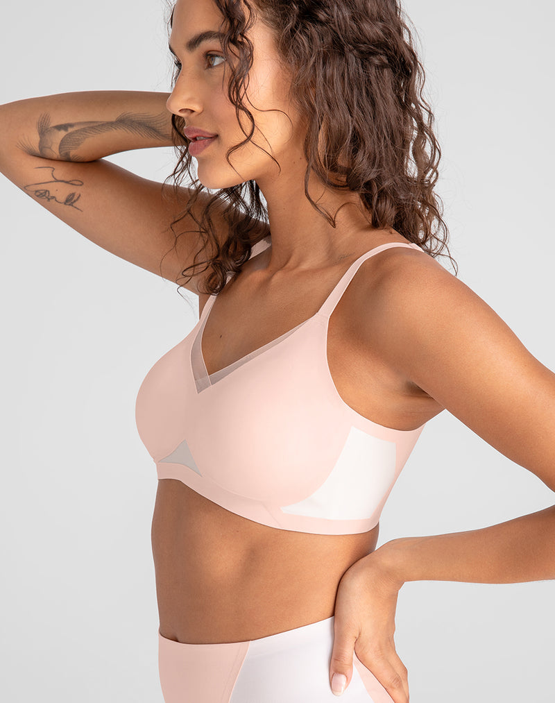Model Jessica wearing CrossOver Bra in size Small and color Petal, seen from the Side