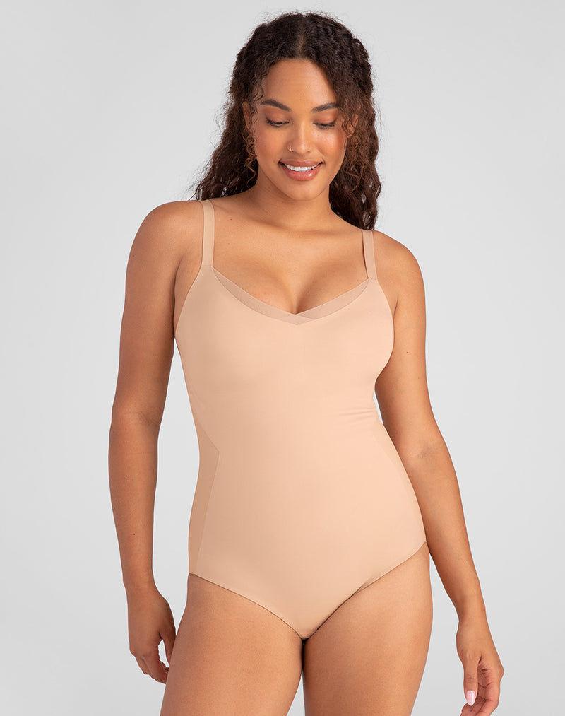 Model Mei wearing CrossOver Cami Bodysuit in size Medium and color Sand, seen from the Front