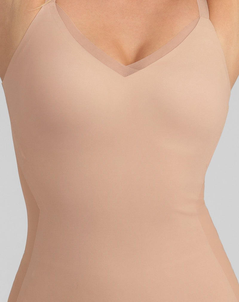 Detail of model wearing CrossOver Cami Bodysuit in color Sand