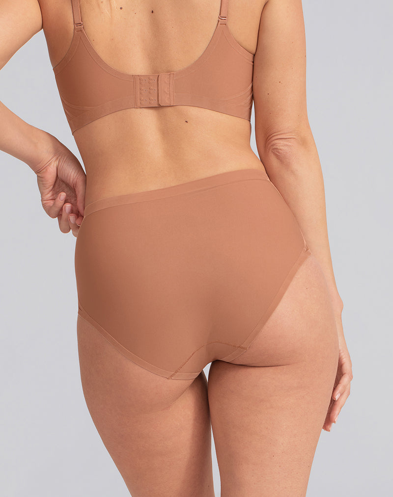 Model Katie wearing Silhouette Brief in size Medium and color Cinnamon, seen from the Back