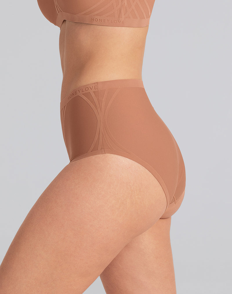 Model Katie wearing Silhouette Brief in size Medium and color Cinnamon, seen from the Side